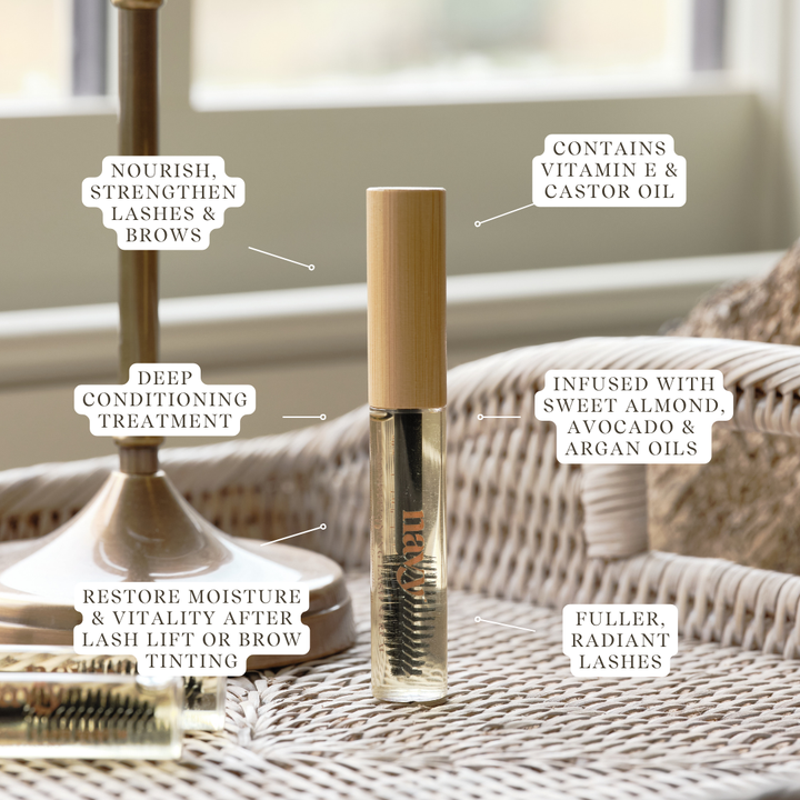 A bottle of Conditioning Lash & Brow Serum with a brush applicator. Supports tihicker, stronger lashes. Vitamin E and castor oil