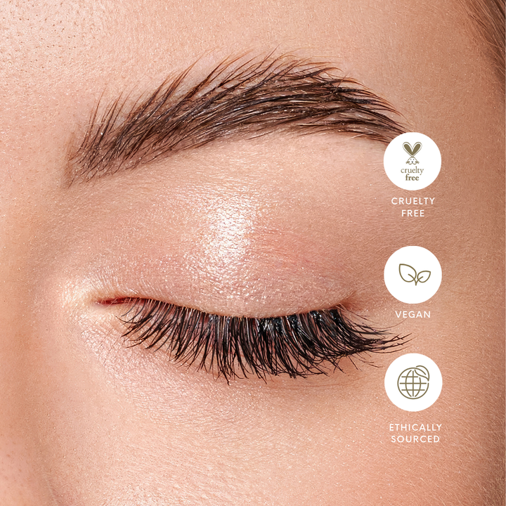 A bottle of Conditioning Lash & Brow Serum with a brush applicator. Supports tihicker, stronger lashes.Vegan. Ethically Sourced. Cruelty Free