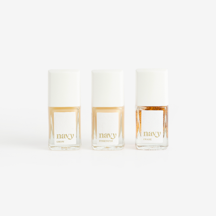Three bottles of Navy brand nail treatment product arranged side by side against a white background.