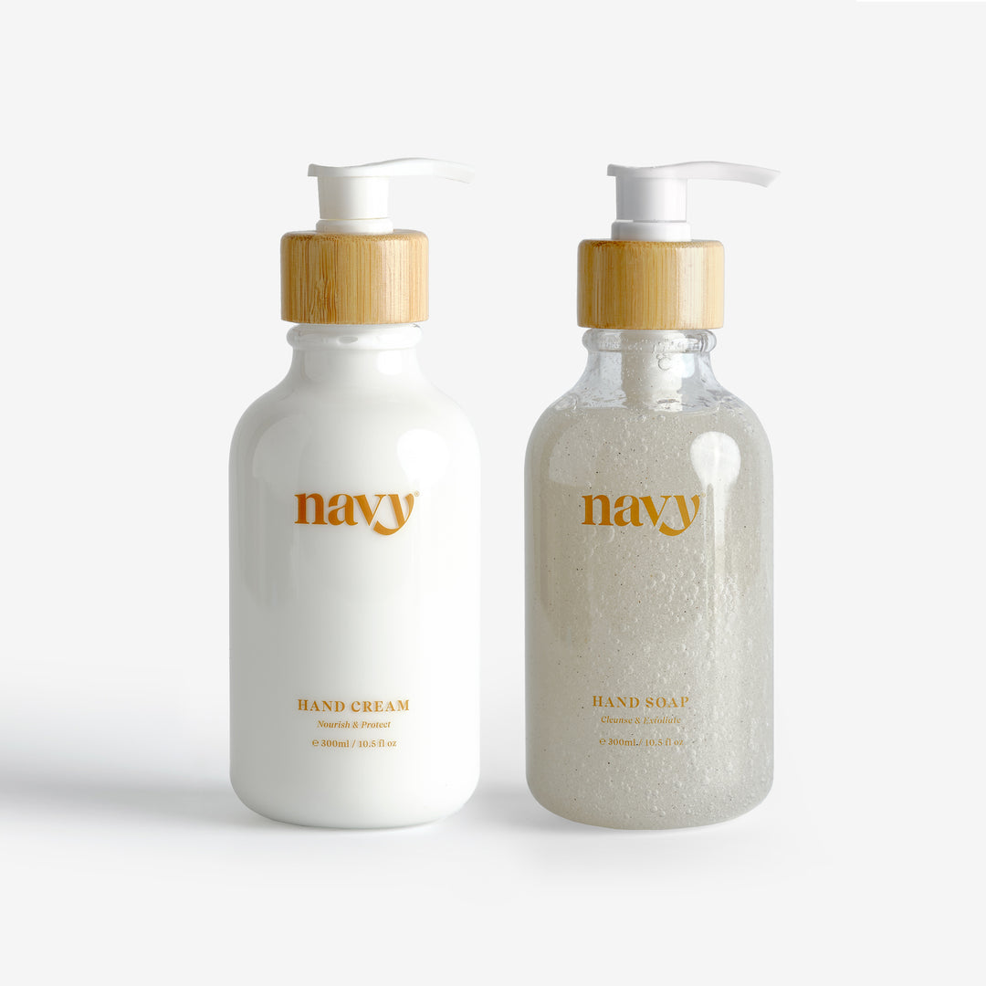 Two pump bottles labeled 'navy', one for hand cream and one for hand wash, against a white background.