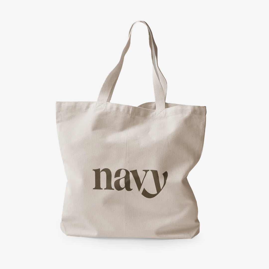 A navy-colored cotton tote bag with the word 'navy' printed on the front.