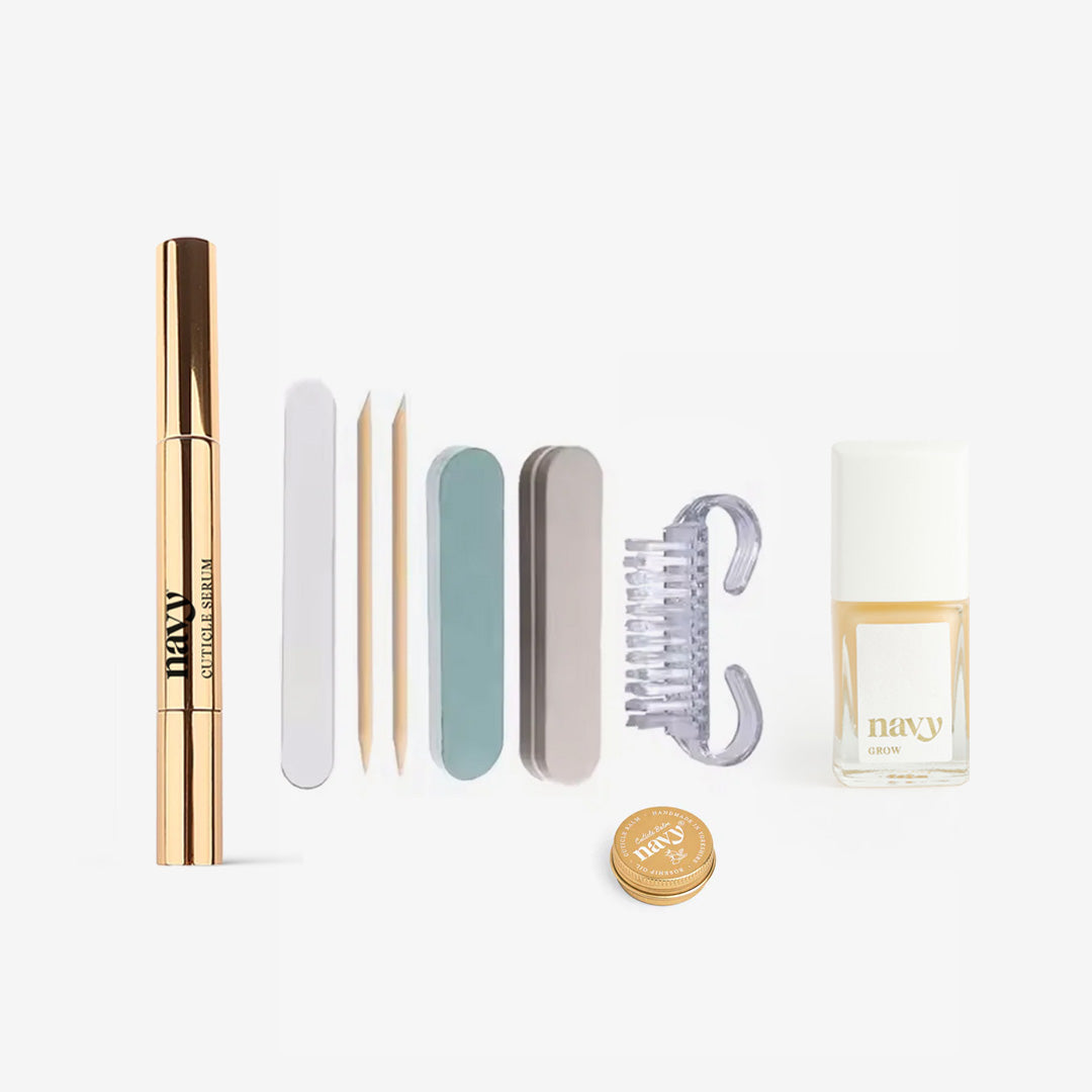 Collection of beauty products including a nail files, nail brush, cuticle pen and other nail treatment items on a white background.