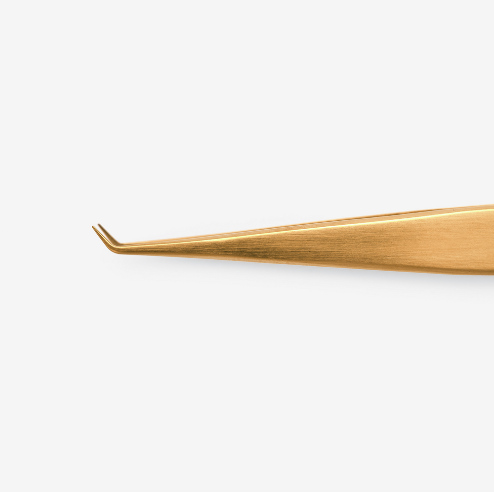 A pair of extended detail tweezers with a titanium coating, primarily gold in color, branded with the name 'Sandra'.