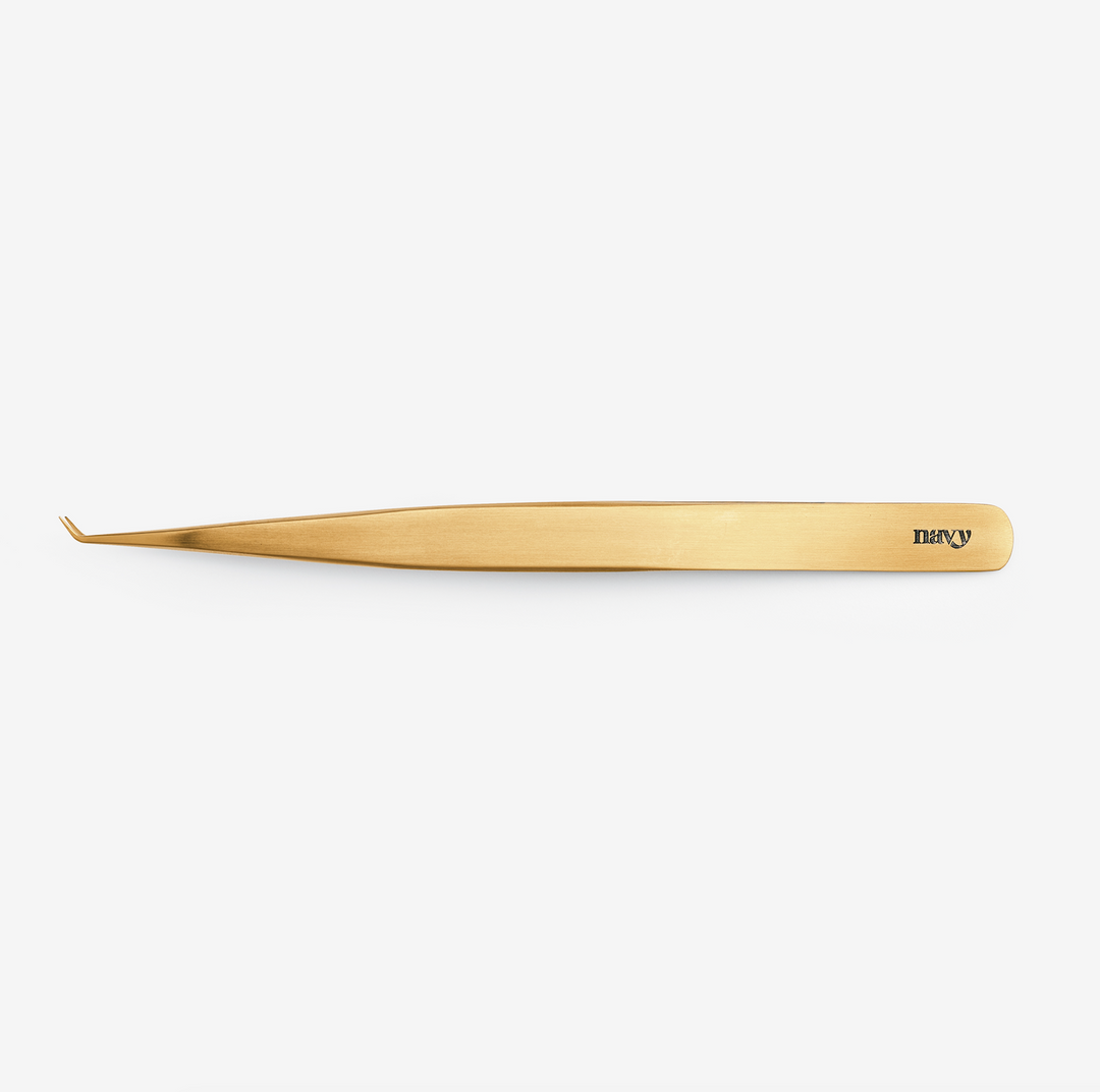 A pair of extended detail tweezers with a titanium coating, primarily gold in color, branded with the name 'Sandra'.
