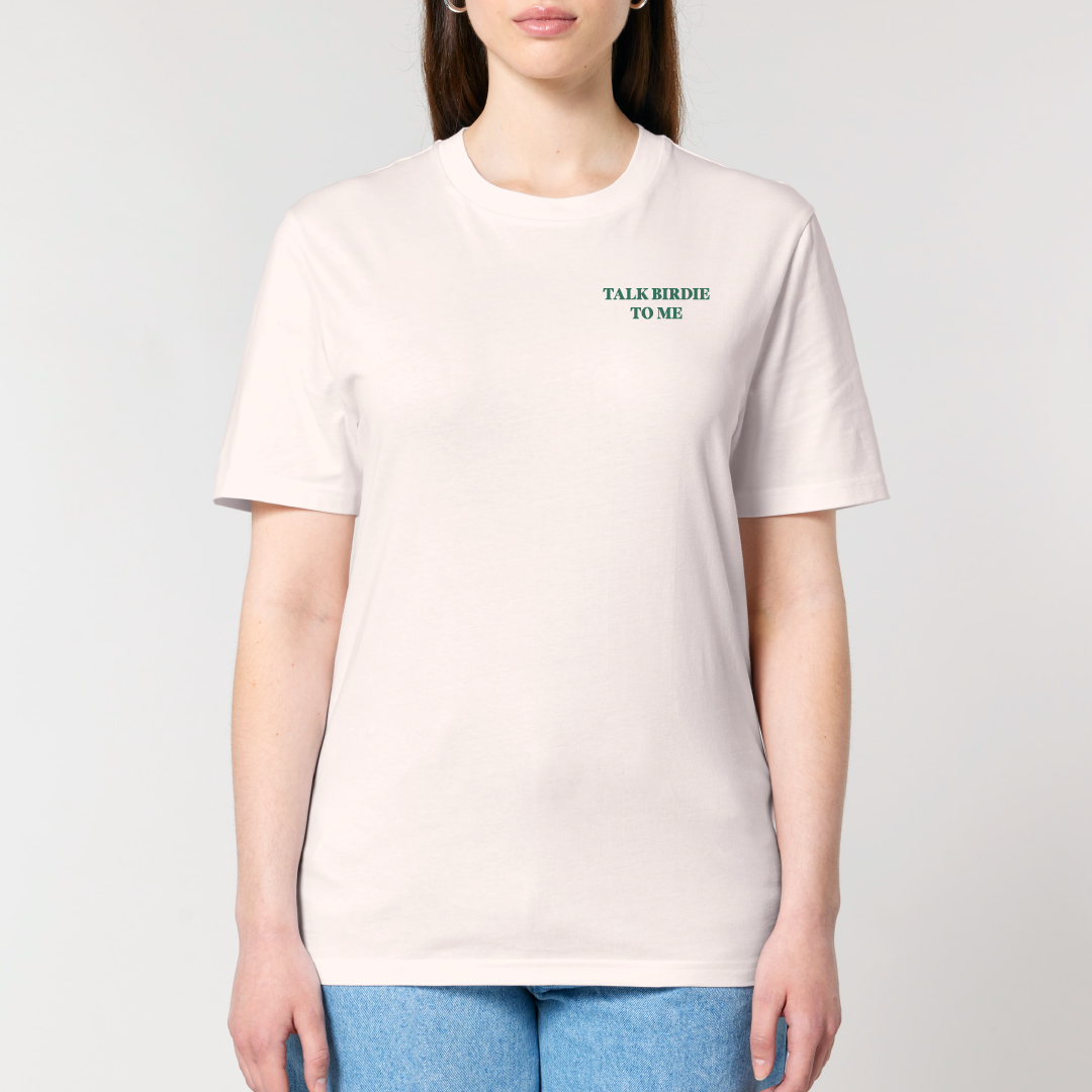 Person wearing a white t-shirt with text on a plain background