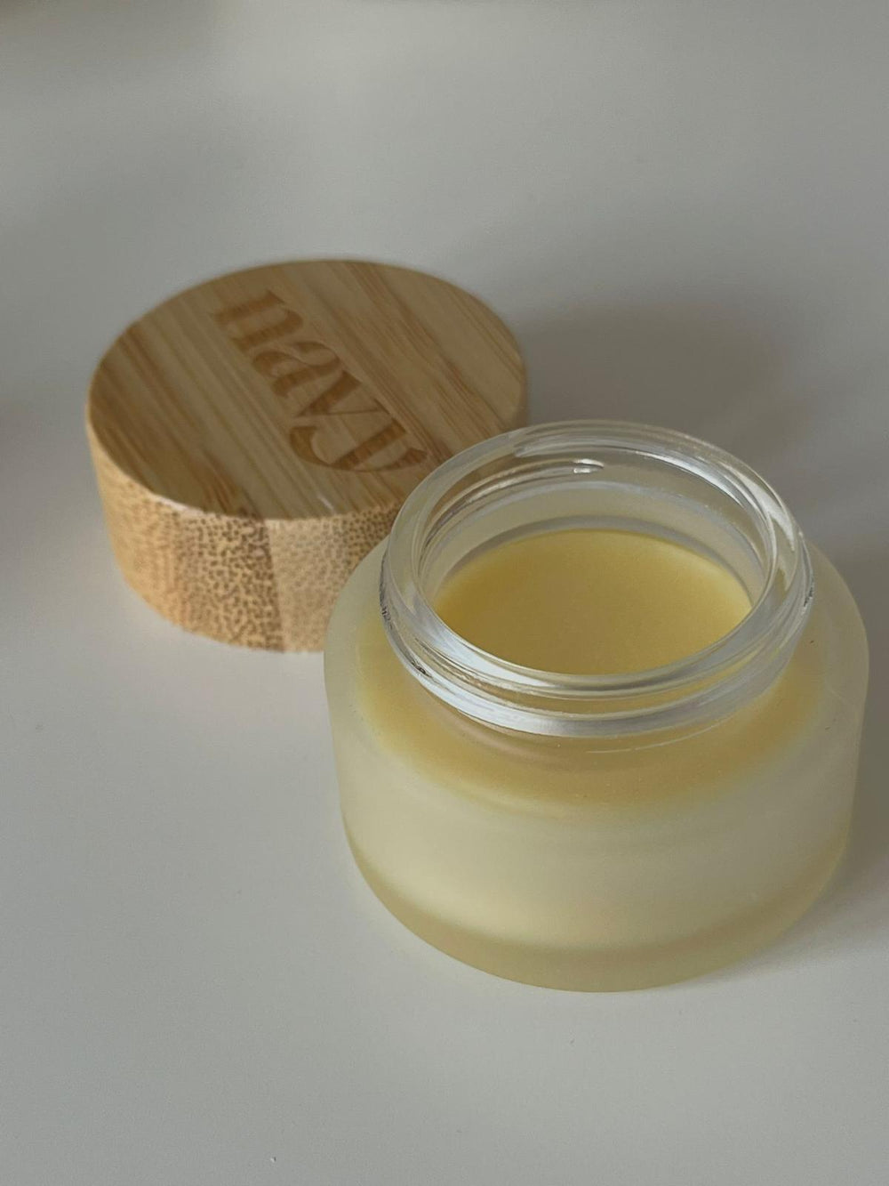 Botanical lip balm in Eucalyptus Mint scent in small round pot. Infused with plant-derived oils
