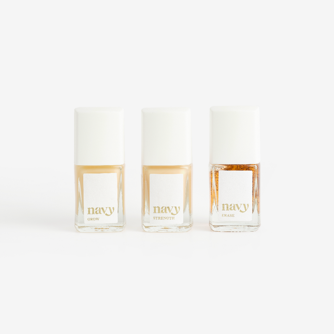 Three bottles of Navy brand nail treatment product arranged side by side against a white background.