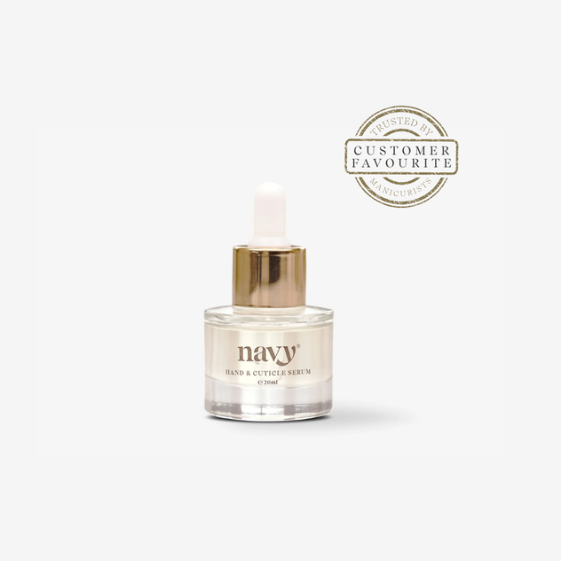Navy hand cuticle serum bottle with gold cap on a white background