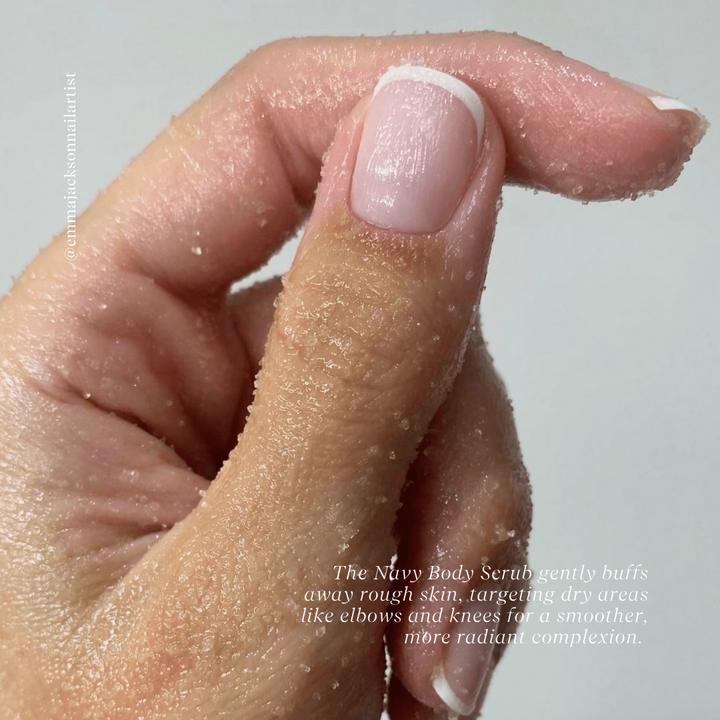 The Navy Body Scrub gently buffs away rough skin, targeting dry areas like elbows and knees for a smoother, more radiant complexion. 