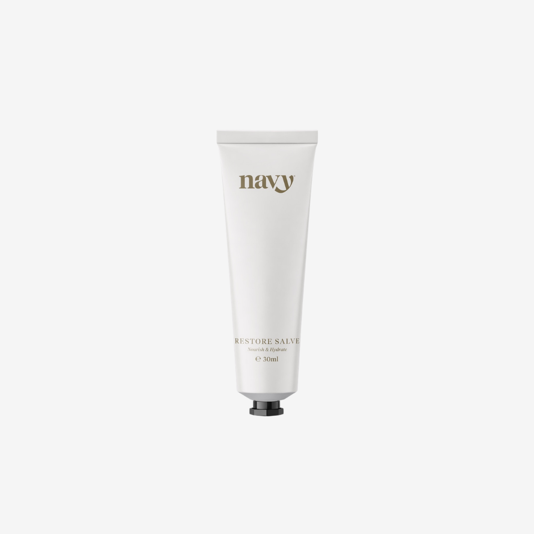 White tube of 'navy' balm on a white background