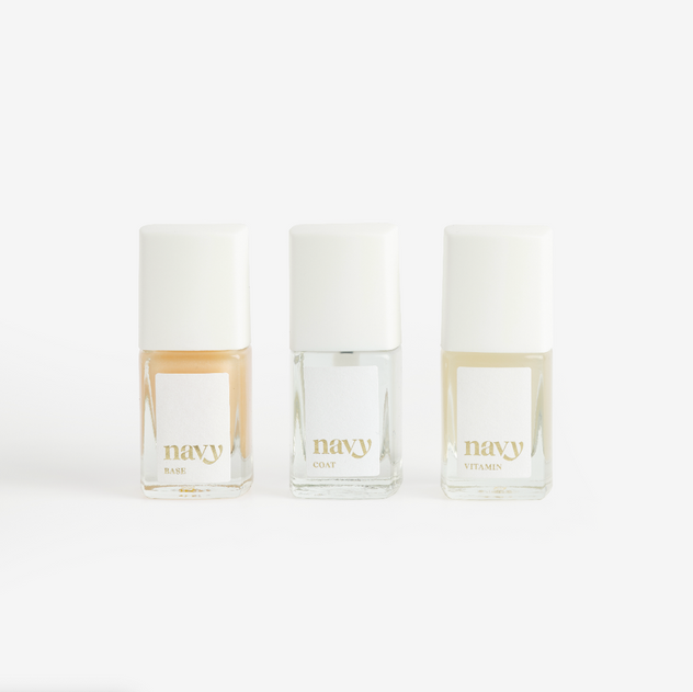 Three bottles of nail treatment product from the Recover & Protect kit, with clear and golden liquid contents, displayed against a white background.