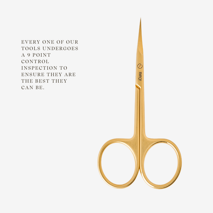Gold scissors on a white background with text about quality control.