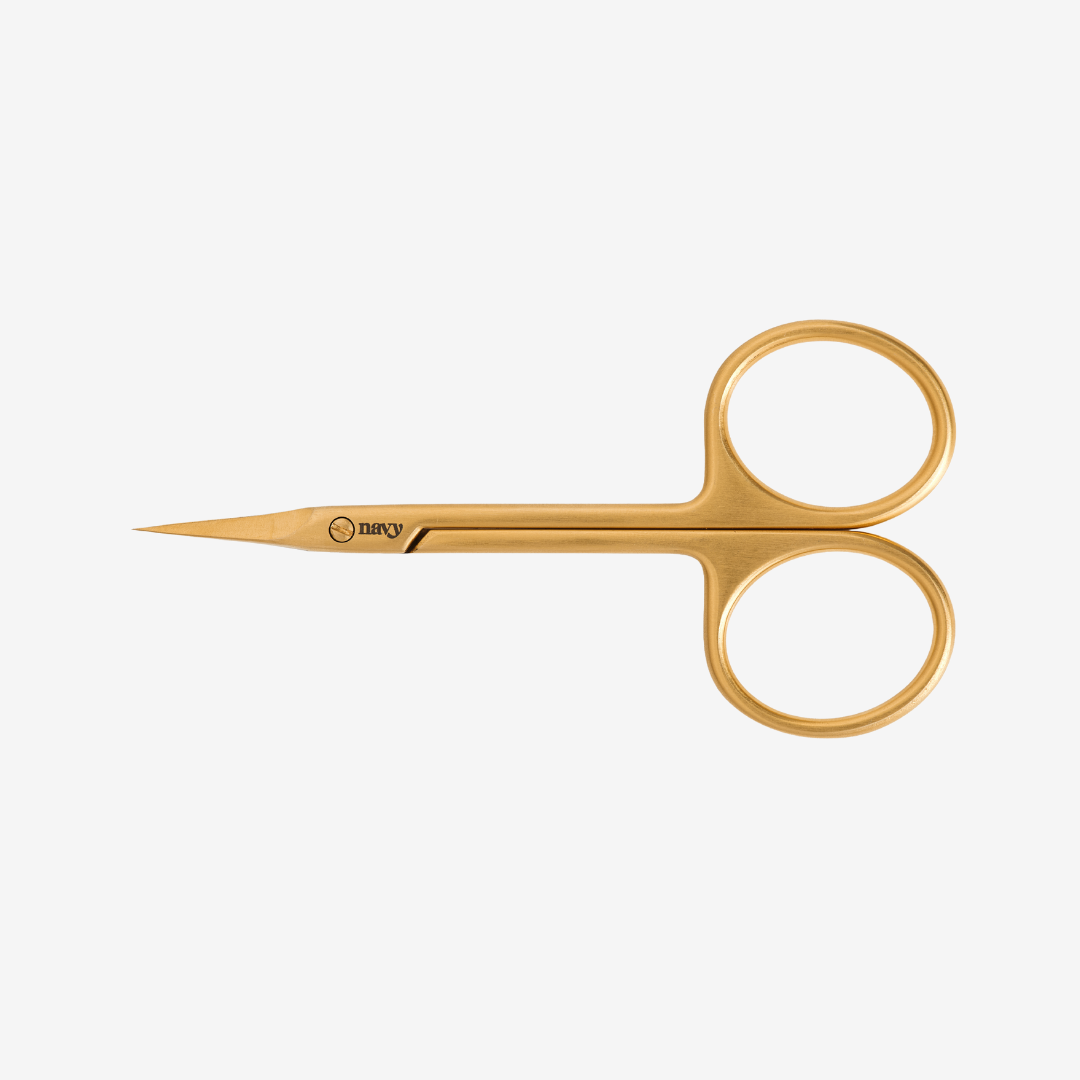 Gold embroidery scissors on a white background