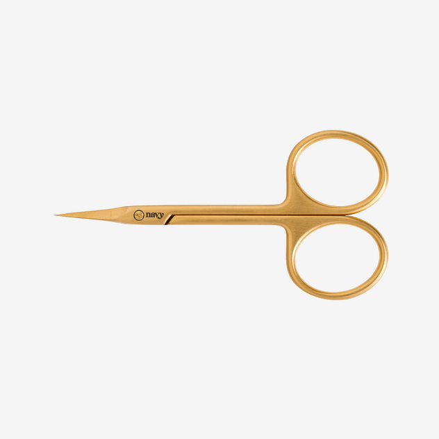 Gold embroidery scissors on a white background