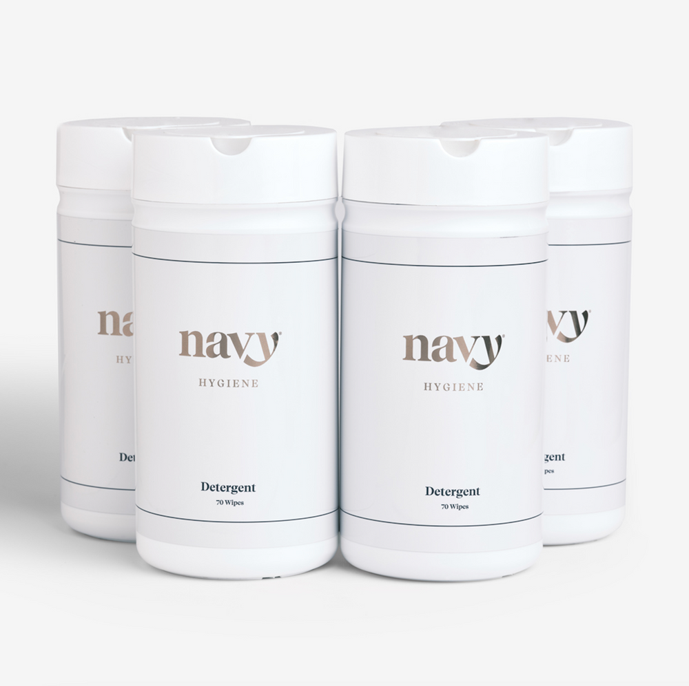 Four bottles of Navy branded salon hygiene wipes, four labeled as 'Detergent Wipes' and four  as 'Disinfecting Wipes'.