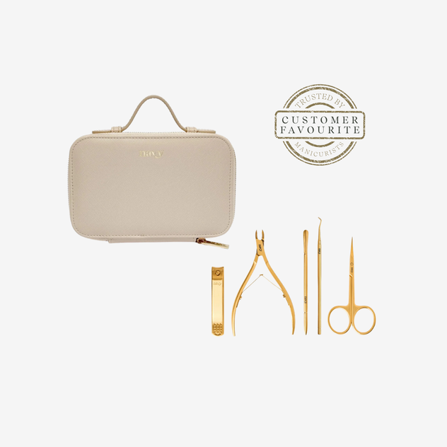 Beige travel case with gold nail care tools on a white background