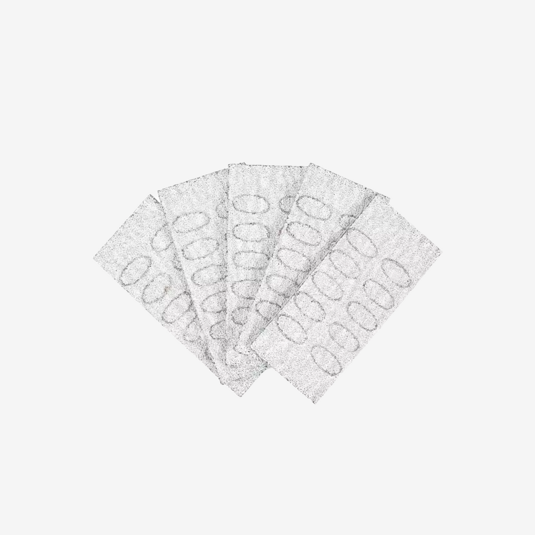 A collection of nail file pads fanned out, showing their textured surface.
