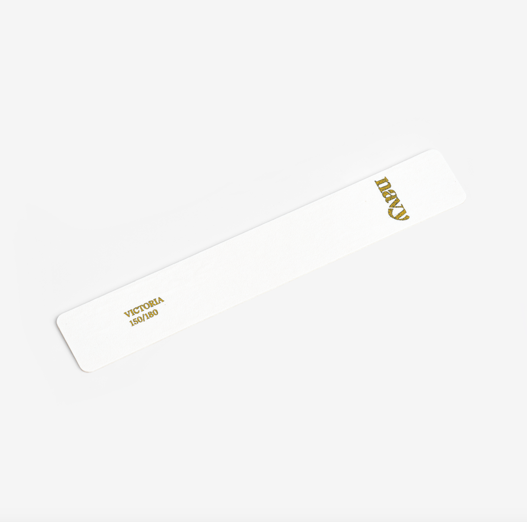White nail file with gold text on a white background