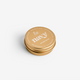 A gold-colored 30ml aluminum tin of Navy Cuticle Balm with the brand name 'Navy' displayed on the lid.