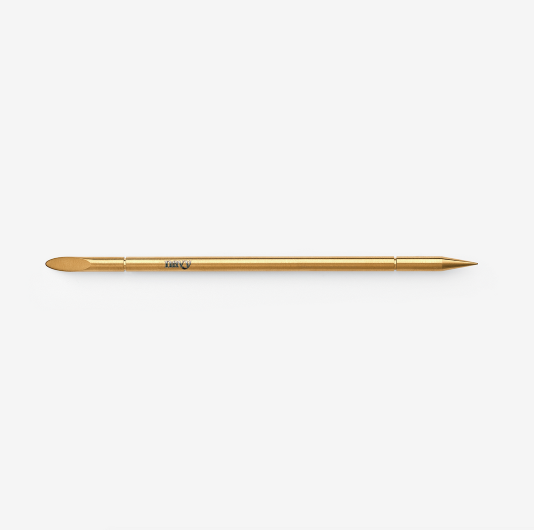 Gold brow and nail multi-tool. Eyebrow and nail prep