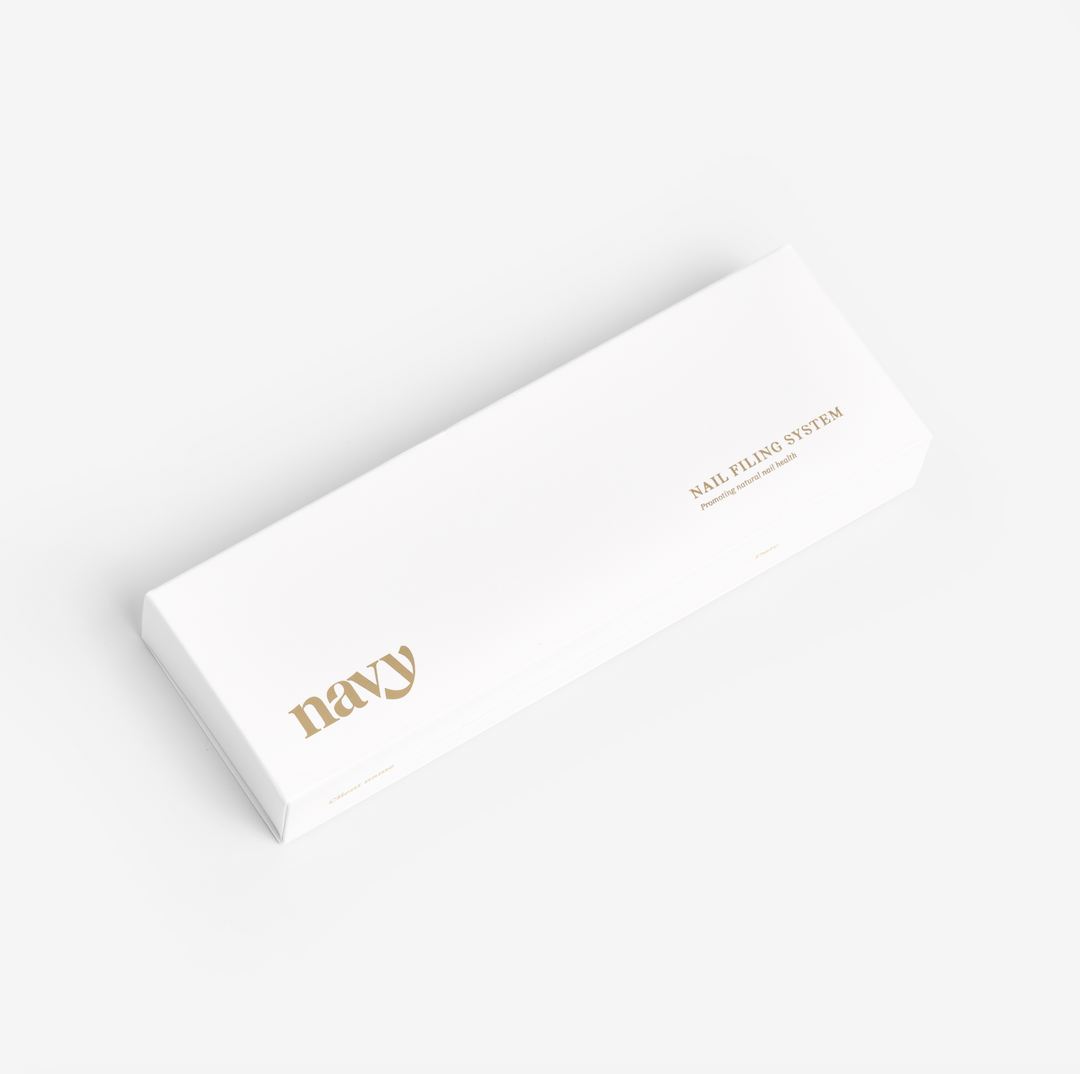A white nail file storage box with the brand name 'Navy' printed in gold lettering on the side.