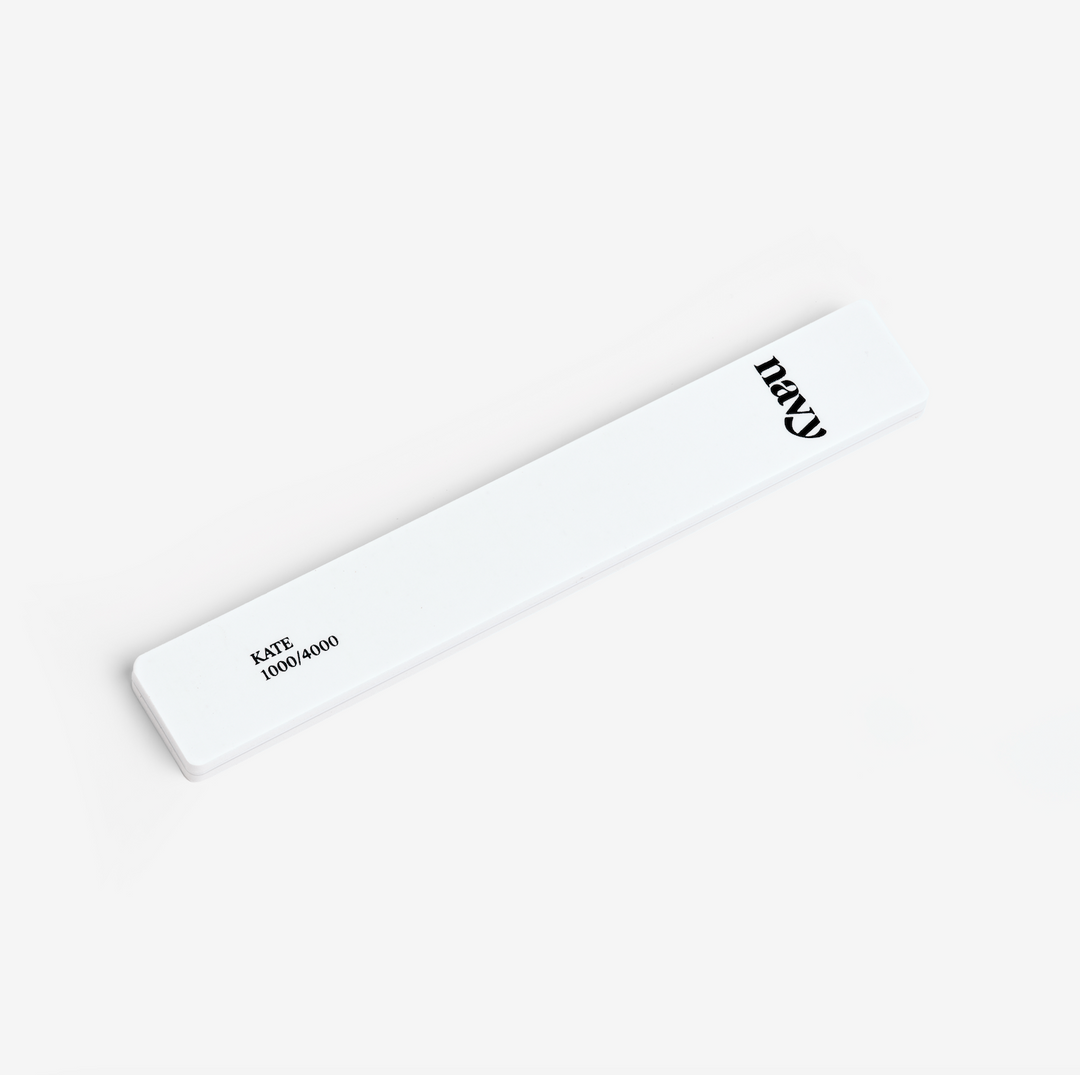 A white nail enhancer file with the brand name 'Kate' printed in black text.